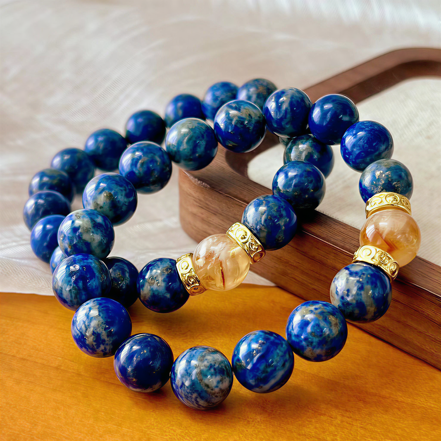 Multiple natural Lapis Lazuli and Citrine bracelets showing blue mineral patterns and golden focal details