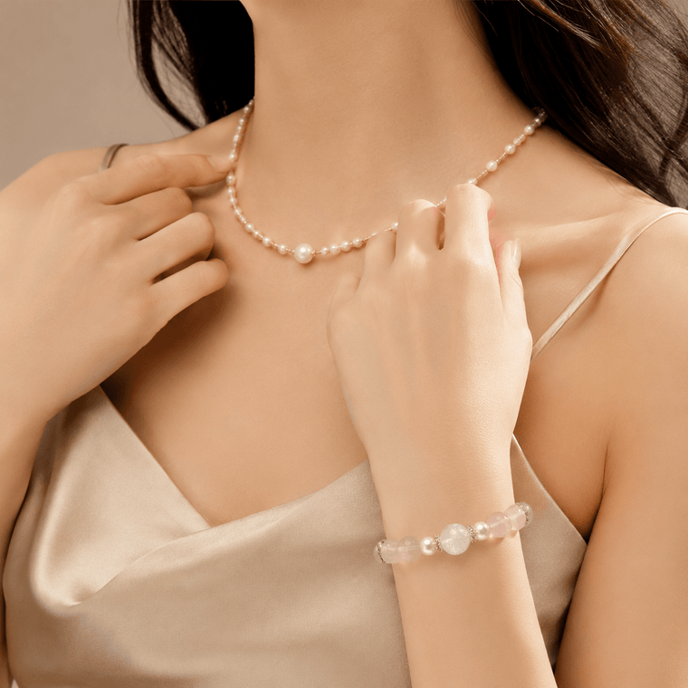 Love Lives Here Rose Quartz bracelet styled with pearl necklace and satin outfit