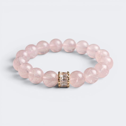 Front view of Soft Devotion bracelet with 12mm natural Rose Quartz beads and gold-tone centerpiece