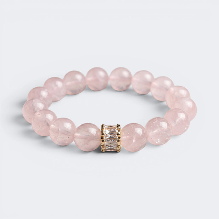 Front view of Soft Devotion bracelet with 12mm natural Rose Quartz beads and gold-tone centerpiece