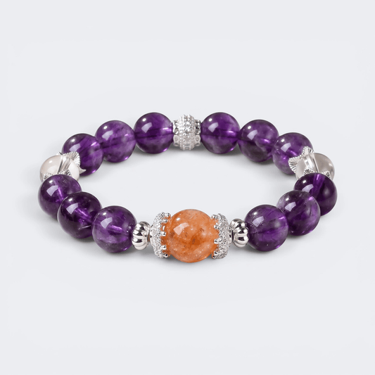 Front view of The Courage to Bloom bracelet with 11mm natural Amethyst beads, Red Hematoid Quartz centerpiece, and Clear Quartz accents