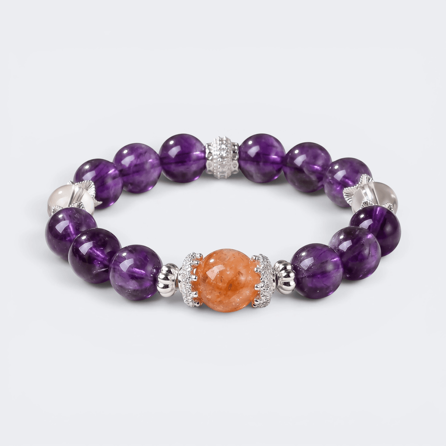 Front view of The Courage to Bloom bracelet with 11mm natural Amethyst beads, Red Hematoid Quartz centerpiece, and Clear Quartz accents