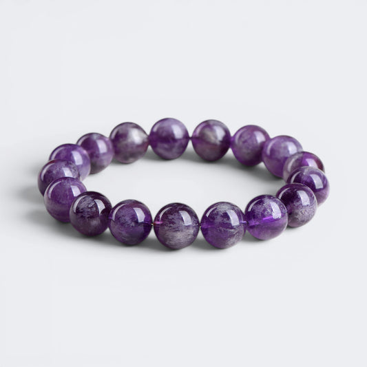 Front view of The Stillness Within bracelet with 12mm natural Amethyst beads in deep violet tones