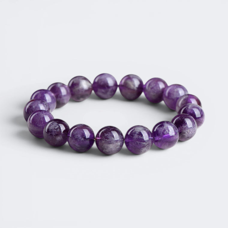 Front view of The Stillness Within bracelet with 12mm natural Amethyst beads in deep violet tones