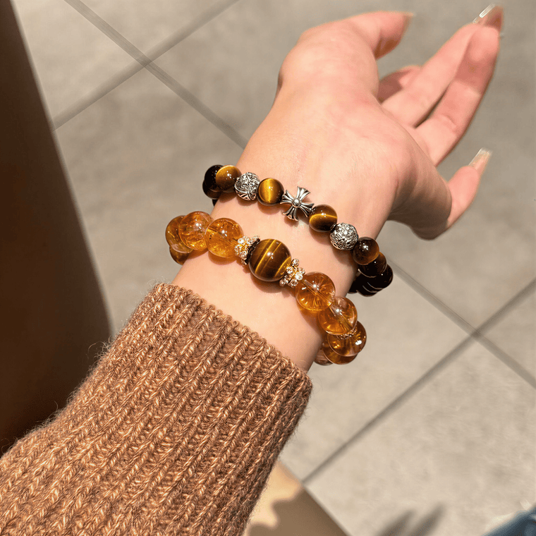 Tiger's Eye cross bracelet styled in a stacked bracelet look